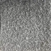 Gray rug with dense, short fibers exhibiting a medium gray tone and subtle tonal variations in a uniform, plush texture.